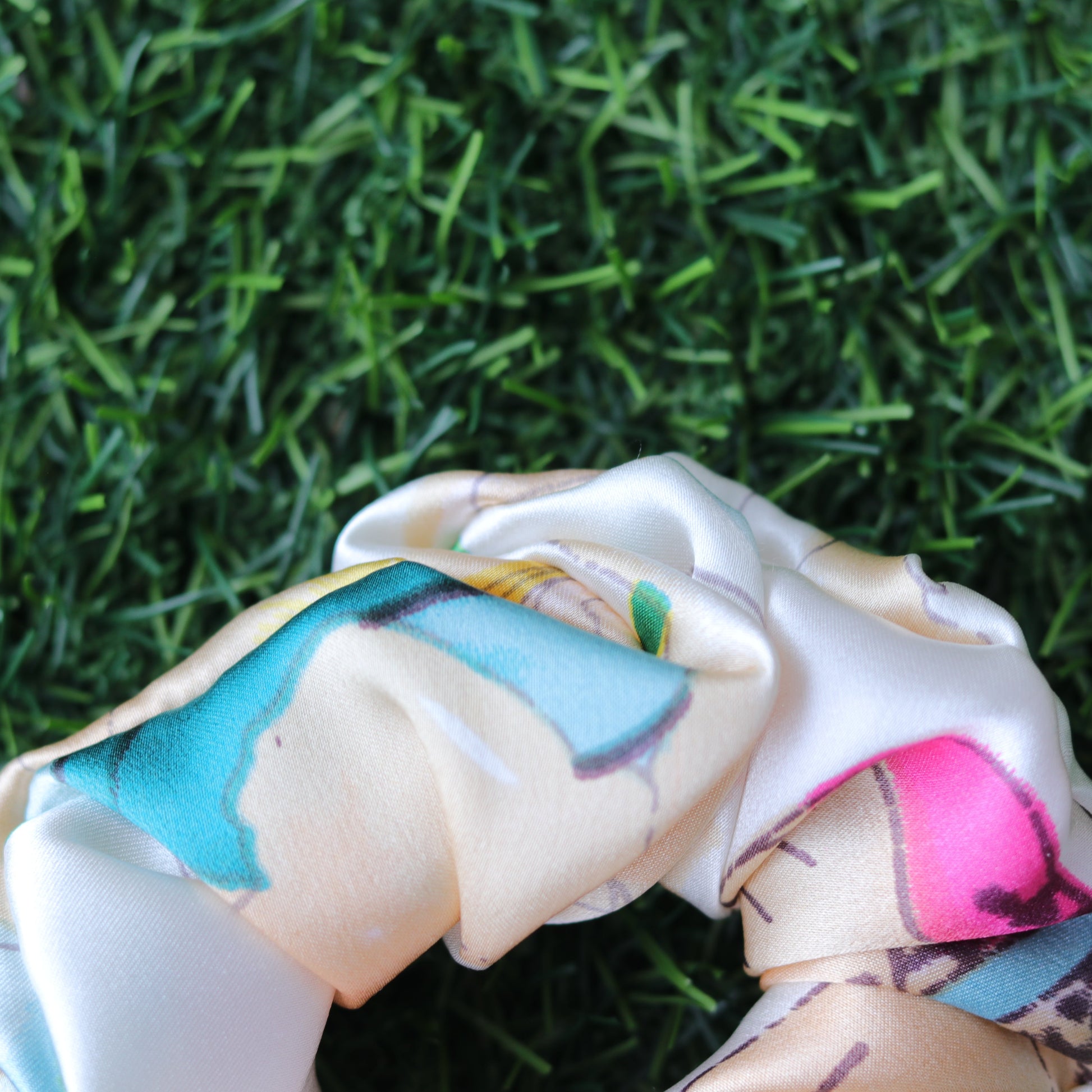 Colorful hair tie with a pattern on grass