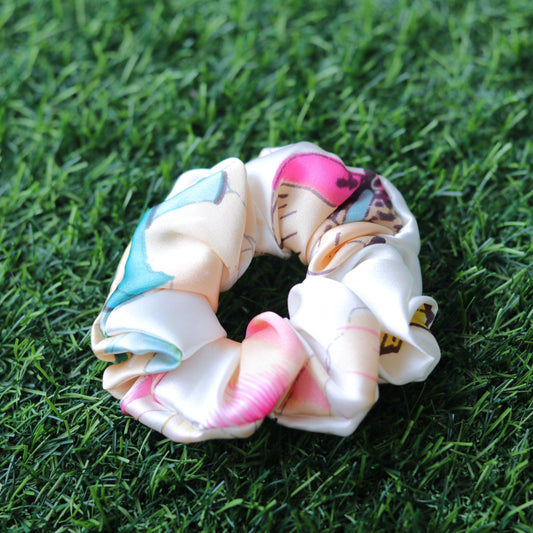 Colorful scrunchies on a grass background